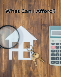 Flat lay of a house cutout with keys, magnifying glass, and calculator on a wooden surface with the text “What Can I Afford?”