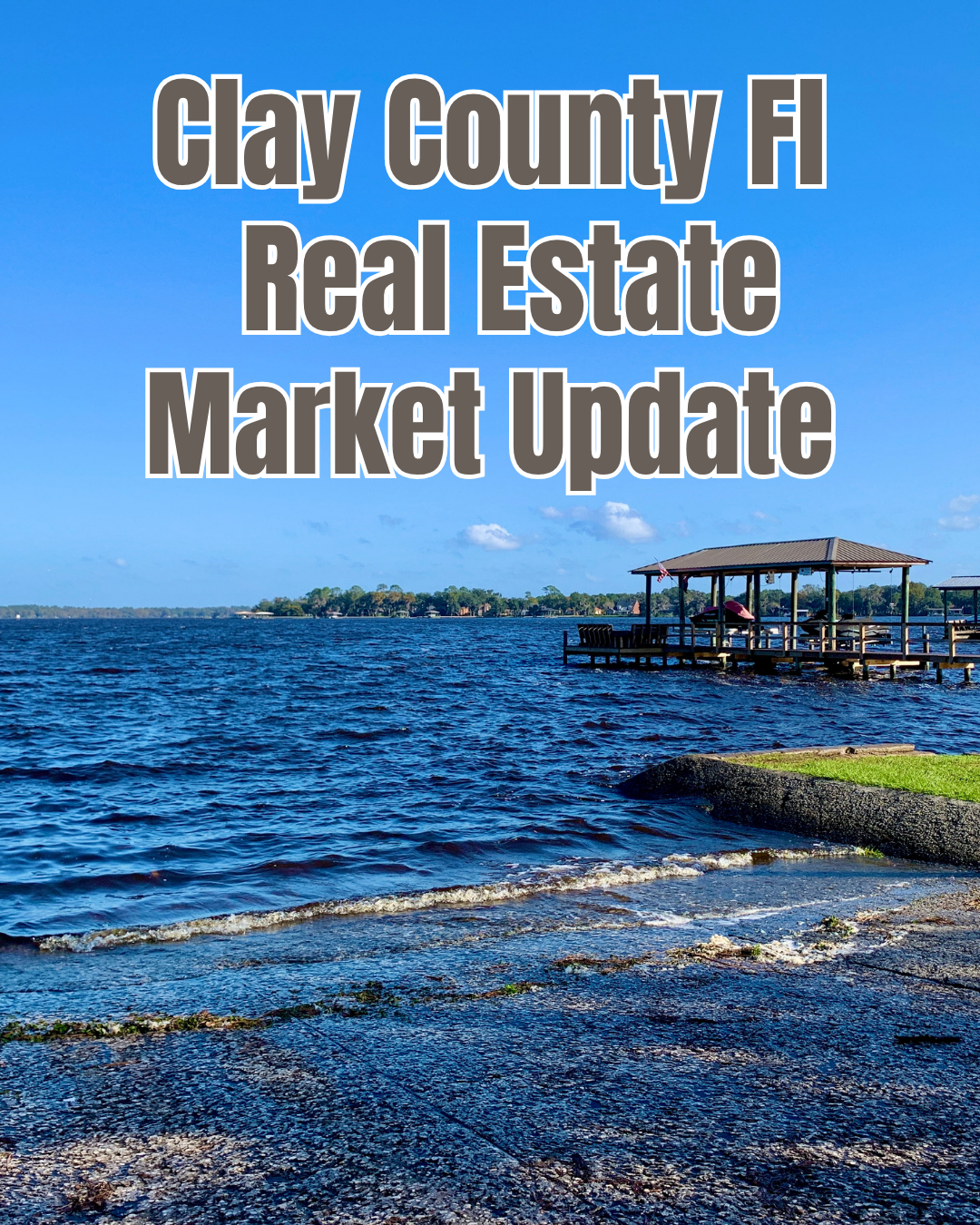 Clay County, Florida real estate market update graphic featuring a waterfront scene with blue water, a shoreline, and a covered dock beneath a bright blue sky.